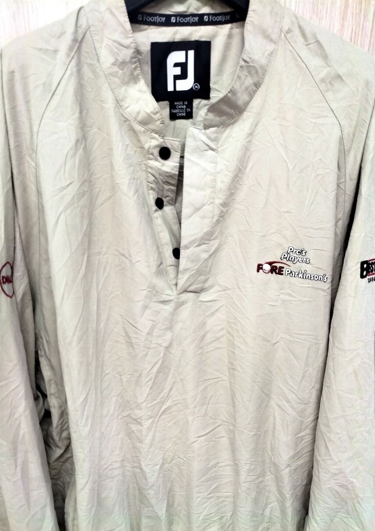 Footjoy FJ Golf Pullover Fore Parkinson's (Category: Golf) located in Caloocan City. Submitted by safebear_4bdc70 (Listing ID 1446635855, Image 1). Description: Lightweight Footjoy pullover. Beige color. Features the FJ logo and 'Fore Parkinson's' embroidery on the chest. Also has a small embroidered logo on the left sleeve. Snap button closure at the neck. Great for layering on the golf course.Size L..