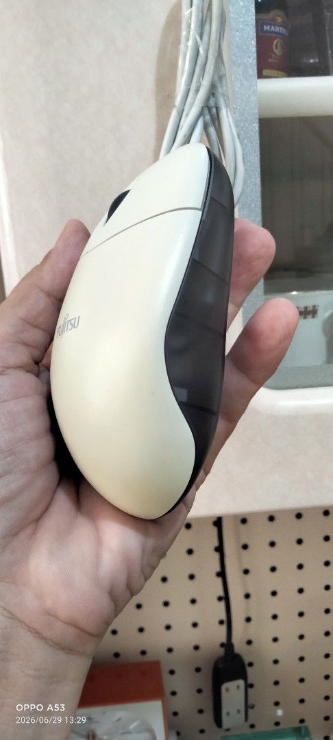 Fujitsu Wired USB Optical Mouse (Category: Mouse & Mousepads) located in Binan City. Submitted by rpute (Listing ID 1446581682, Image 3). Description: - Fujitsu wired optical mouse - Cream color with dark grey sides - USB connection - Simple plug and play functionality - Works well for everyday computer use.