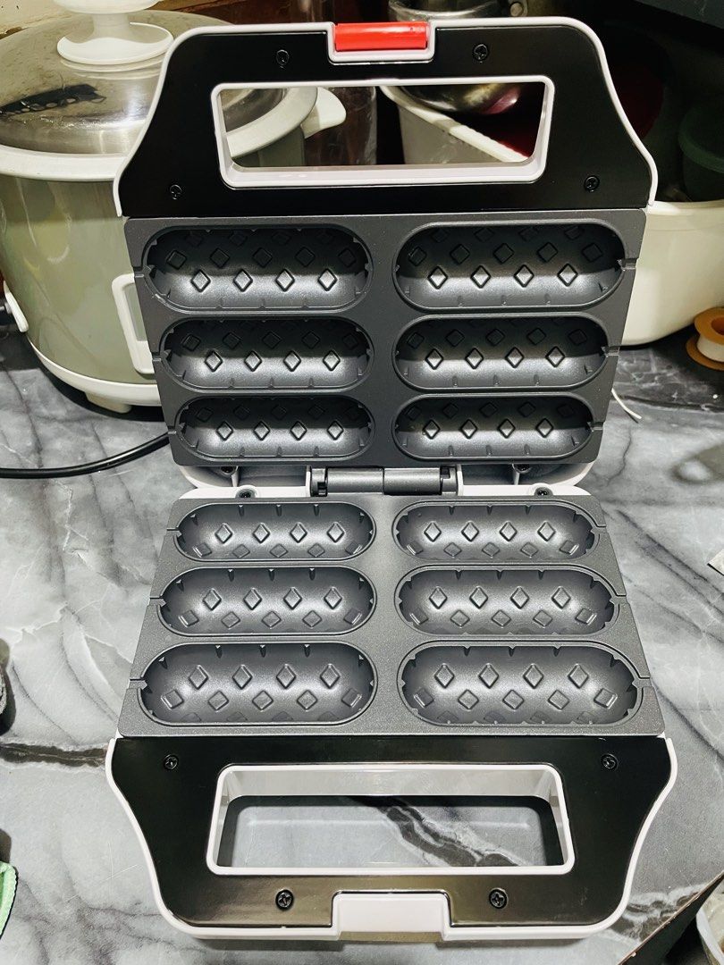Hanabishi Hotdog Waffle Maker (Category: Other Kitchen Appliances) located in Taytay. Submitted by beautique_mnla (Listing ID 1446626207, Image 3). Description: Super bago pa! As in ni flaws or anything. Natapon nalang yung box. Bought it for our small business sana kaso di rin natuloy yung pagbenta ng waffle. Used once only (sinubukan lang if working) Good as brand new Originally bought around ₱1,200.