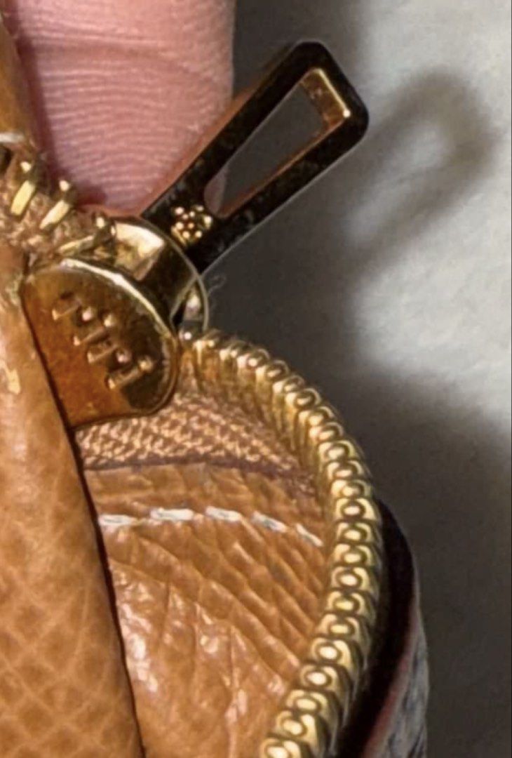 Hermes Bearn Wallet (gold on gold) (Category: Luxury Bags & Wallets) located in Cavite. Submitted by okaypreloved (Listing ID 1446611618, Image 2). Description: •TARNISHED HARDWARE •BROKEN STITCHINGS •WORN OUT COLOR •STRAP ALREADY FLIMSY (DIFFICULT TO TUCK BACK IN)(SOFT ALREADY) bought here in carousel as well but never used https://www.hermes.com/pt/en/product/bearn-wallet-H084871CC37/ ALL SALES ARE FINAL AND NONRETURNABLE.