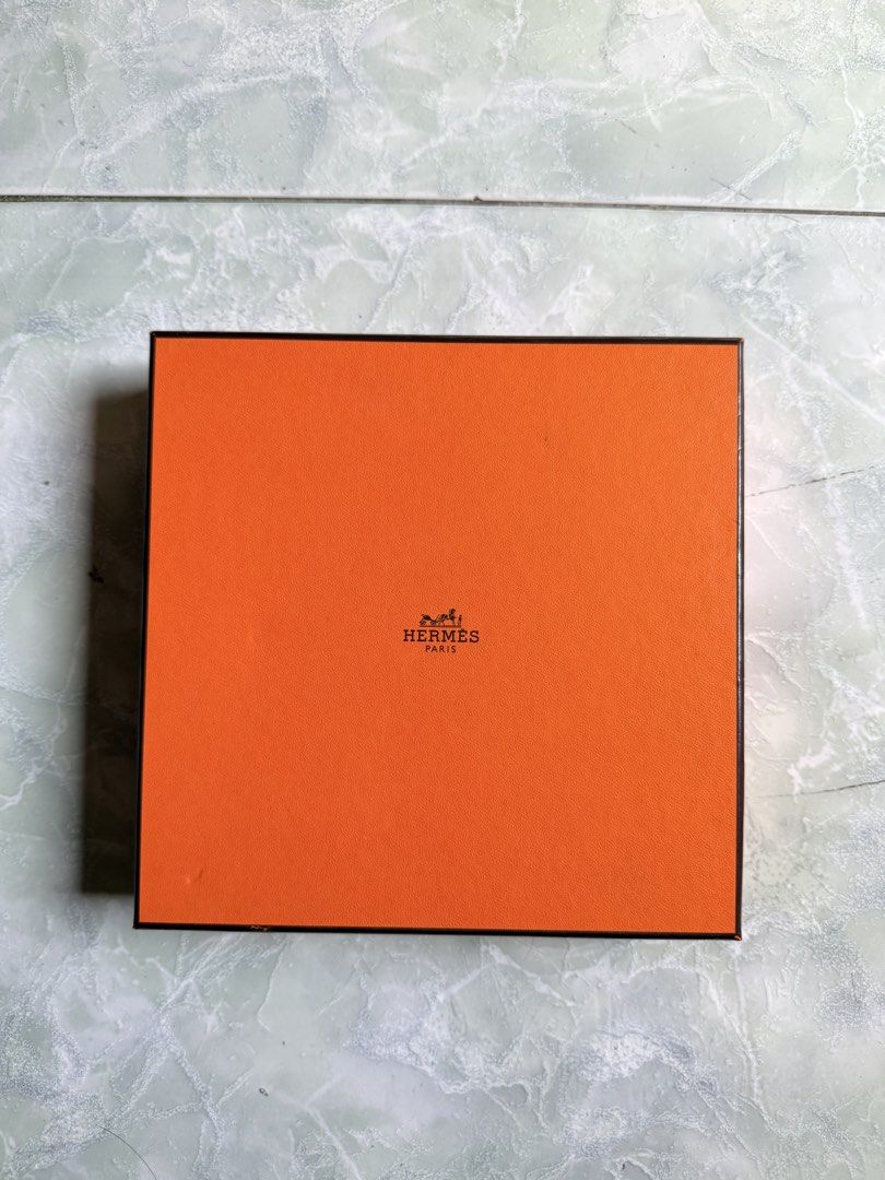 Hermes Paris Orange Box with Branded Ribbon (Category: Luxury Accessories) located in General Santos City (Dadiangas). Submitted by ssssshhhhhhhhh (Listing ID 1446568255, Image 1). Description: Original Hermes Paris orange box. Comes with the iconic Hermes ribbon. Ribbon has the horse and carriage motif. Perfect for gifting or storing small luxury items. Selling as is..