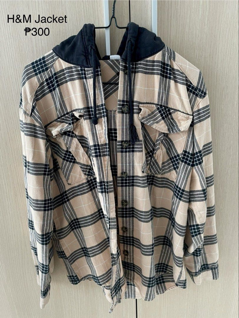 H&M Plaid Flannel Hoodie Jacket (Category: Coats, Jackets and Outerwear) located in Manila. Submitted by hellonuggy (Listing ID 1446606177, Image 2). Description: - H&M Plaid Jacket - size S - 25” length - Color: Beige, black, and white checkered pattern - Features a black hood with drawstrings - Button-up front with chest pockets - Ideal for layering - Comfortable and stylish Loc: commonwealth QC.