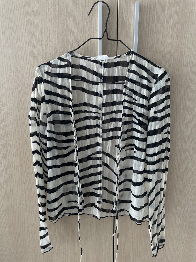 H&M Zebra Tie Front Long Sleeve Top Size S (Category: Blouses) located in Manila. Submitted by hellonuggy (Listing ID 1446603538, Image 2). Description: - Brand: H&M - Features: Tie front closure, sheer material - Size: S - Perfect for layering over bralettes or camisoles - Unique and stylish piece Got for ₱1k+ Loc: commonwealth QC.