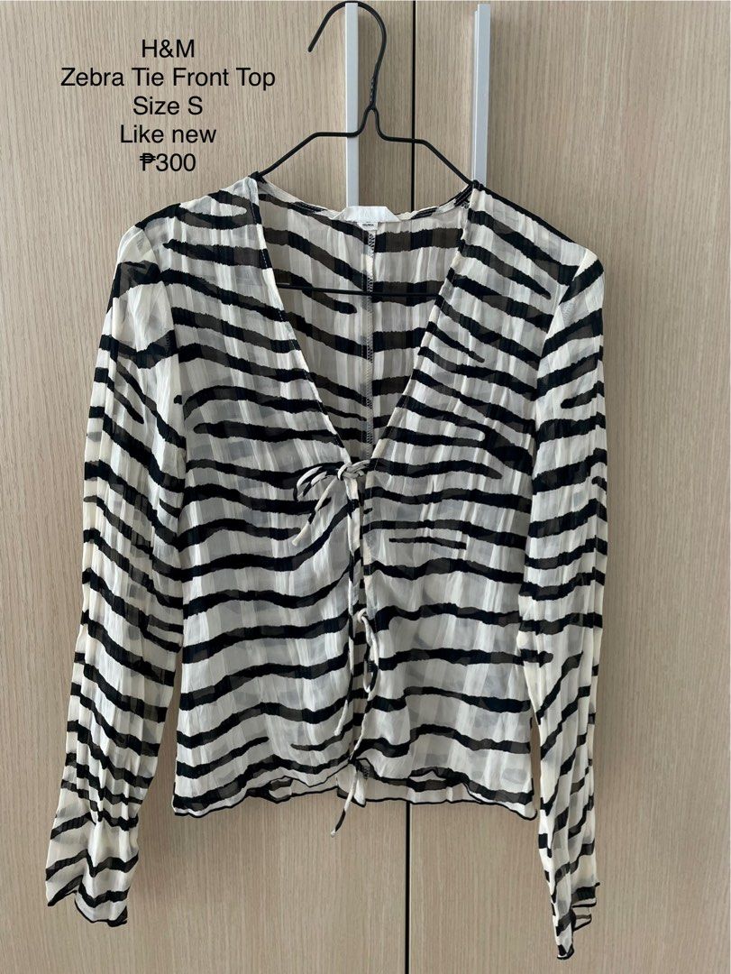 H&M Zebra Tie Front Long Sleeve Top Size S (Category: Blouses) located in Manila. Submitted by hellonuggy (Listing ID 1446603538, Image 1). Description: - Brand: H&M - Features: Tie front closure, sheer material - Size: S - Perfect for layering over bralettes or camisoles - Unique and stylish piece Got for ₱1k+ Loc: commonwealth QC.