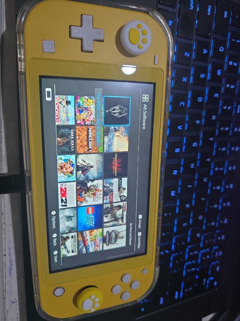 Nintendo Switch Lite (Jailbroken) (Category: Nintendo) located in Taguig. Submitted by cuberootg (Listing ID 1441766240, Image 3). Description: Bought this in UAE. barely used it and just jailbroken recently. shell and buttons like new condition. - Jail broken already with games(TOTK,BOTW,etc) - Includes Skull & Co. case - Screen protector already on - All buttons fully functional and crisp like new - TMR joysticks(no stick drift) - No issues and