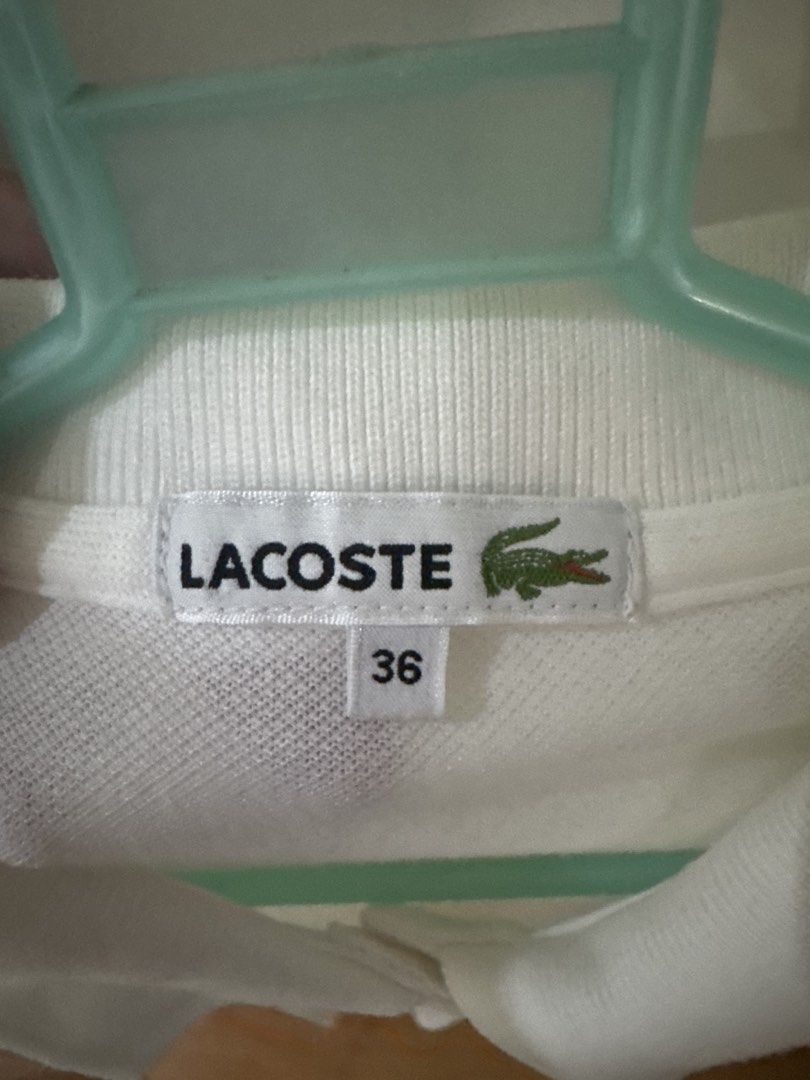 Lacoste White Polo Shirt Size 36 (Category: Others Tops) located in Binan City. Submitted by mituz (Listing ID 1446544068, Image 2). Description: - Classic white Lacoste polo shirt - Iconic crocodile logo on chest - Button-up neckline - Short sleeves - Size 36 - Ideal for casual or smart-casual outfits.