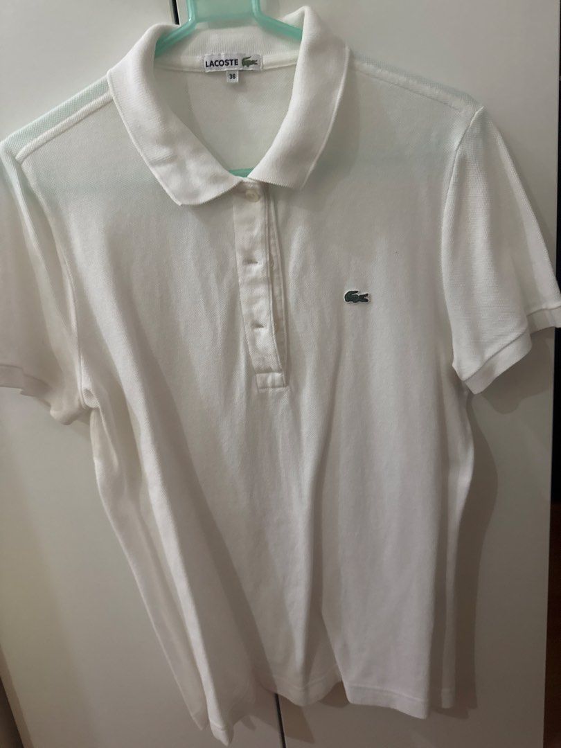 Lacoste White Polo Shirt Size 36 (Category: Others Tops) located in Binan City. Submitted by mituz (Listing ID 1446544068, Image 1). Description: - Classic white Lacoste polo shirt - Iconic crocodile logo on chest - Button-up neckline - Short sleeves - Size 36 - Ideal for casual or smart-casual outfits.