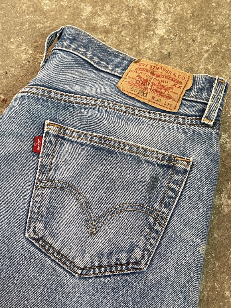 Levi's 501 Jeans 36x34 Light Wash (Category: Jeans) located in Angono. Submitted by semgabrielle13 (Listing ID 1446649816, Image 3). Description: - Classic Vintage Levi's 501 jeans - Light wash denim - Button fly closure - Size: 36 waist, 34 inseam - Unique paint splatters on legs for a worn-in look - Perfect for casual wear or work - Length is 41.5 - Leg hole is 8.5 Issue is paint splatter minor scratch honestly looks like a design not bothering