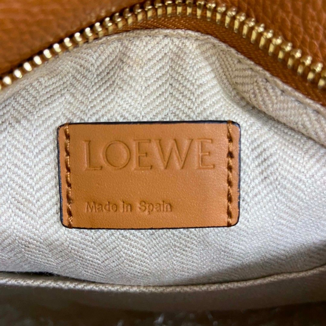 Loewe Puzzle Small Tan Leather Crossbody Bag (Category: Luxury Bags & Wallets) located in Bacolod City. Submitted by capitalismgoods6100 (Listing ID 1446580683, Image 3). Description: - Loewe Puzzle Bag - Small Size - Color: Tan - Material: Pebbled Leather - Hardware: Gold - Closure: Zipper - Interior: Fabric Lining - Origin: Made in Spain - Style: Great everyday bag.