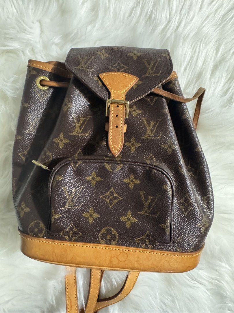 Louis Vuitton Monogram Canvas Backpack (Category: Luxury Bags & Wallets) located in Quezon City. Submitted by jbspreloved (Listing ID 1446664306, Image 1). Description: - Classic Louis Vuitton monogram backpack -Montsouris BB -no cracks -slight watermarks - comes with dustbag .