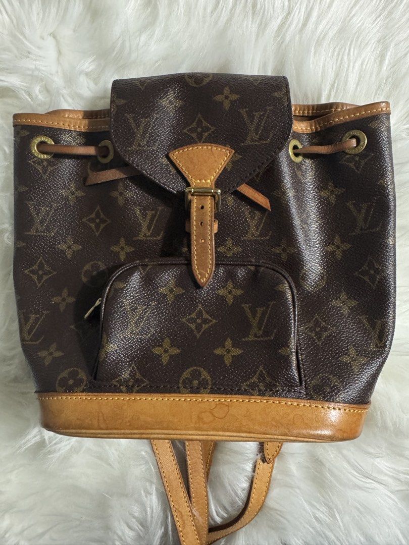 Louis Vuitton Monogram Canvas Backpack (Category: Luxury Bags & Wallets) located in Quezon City. Submitted by jbspreloved (Listing ID 1446664306, Image 2). Description: - Classic Louis Vuitton monogram backpack -Montsouris BB -no cracks -slight watermarks - comes with dustbag .