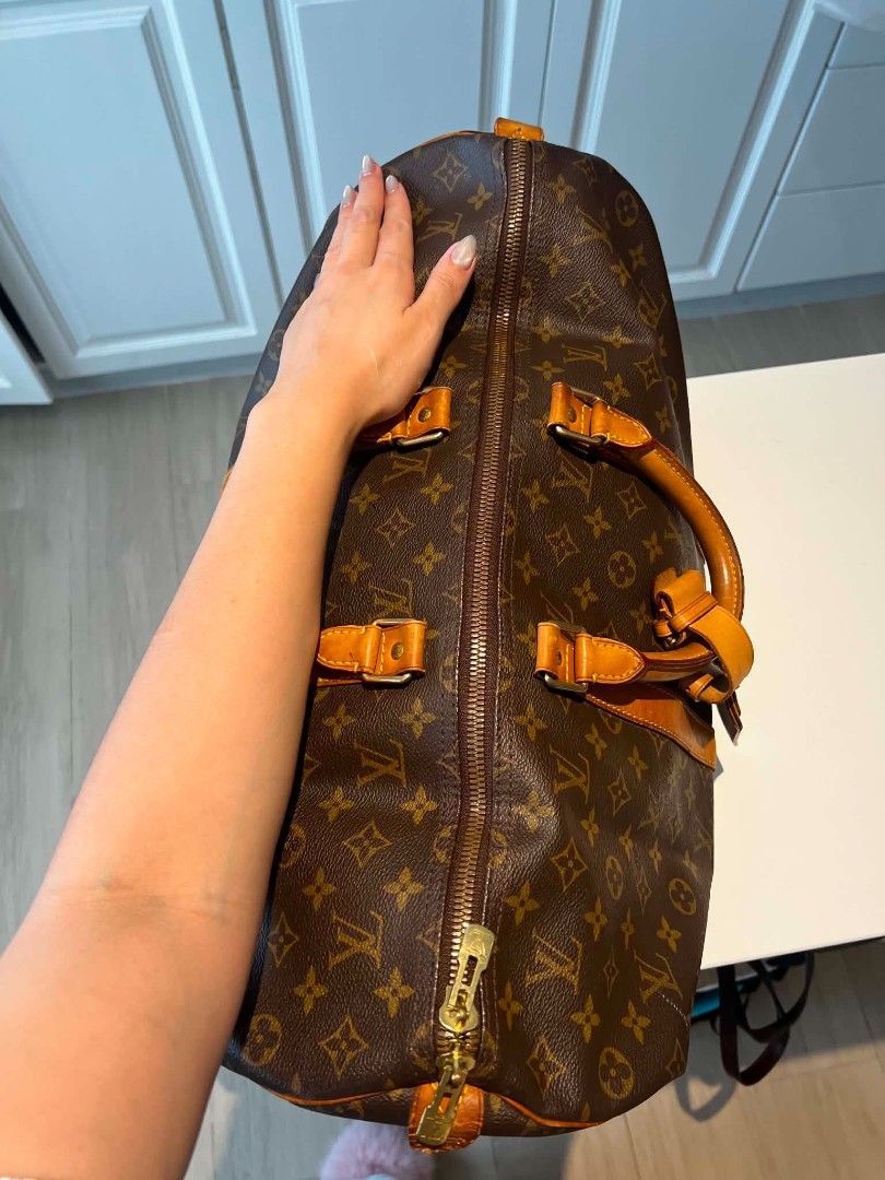 Louis Vuitton Monogram Keepall Duffle Bag (Category: Luxury Bags & Wallets) located in Baguio. Submitted by bangtowanv91137 (Listing ID 1446610016, Image 2). Description: - Classic Louis Vuitton Keepall duffle bag - Iconic monogram canvas - Leather trim and handles with some patina - Smooth working zipper - Spacious interior - Ideal for travel or weekend use.