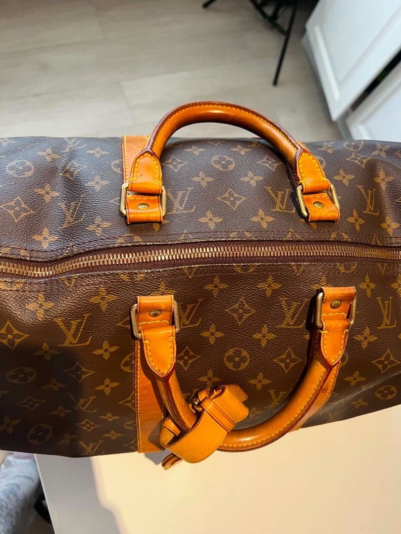 Louis Vuitton Monogram Keepall Duffle Bag (Category: Luxury Bags & Wallets) located in Baguio. Submitted by bangtowanv91137 (Listing ID 1446610016, Image 1). Description: - Classic Louis Vuitton Keepall duffle bag - Iconic monogram canvas - Leather trim and handles with some patina - Smooth working zipper - Spacious interior - Ideal for travel or weekend use.