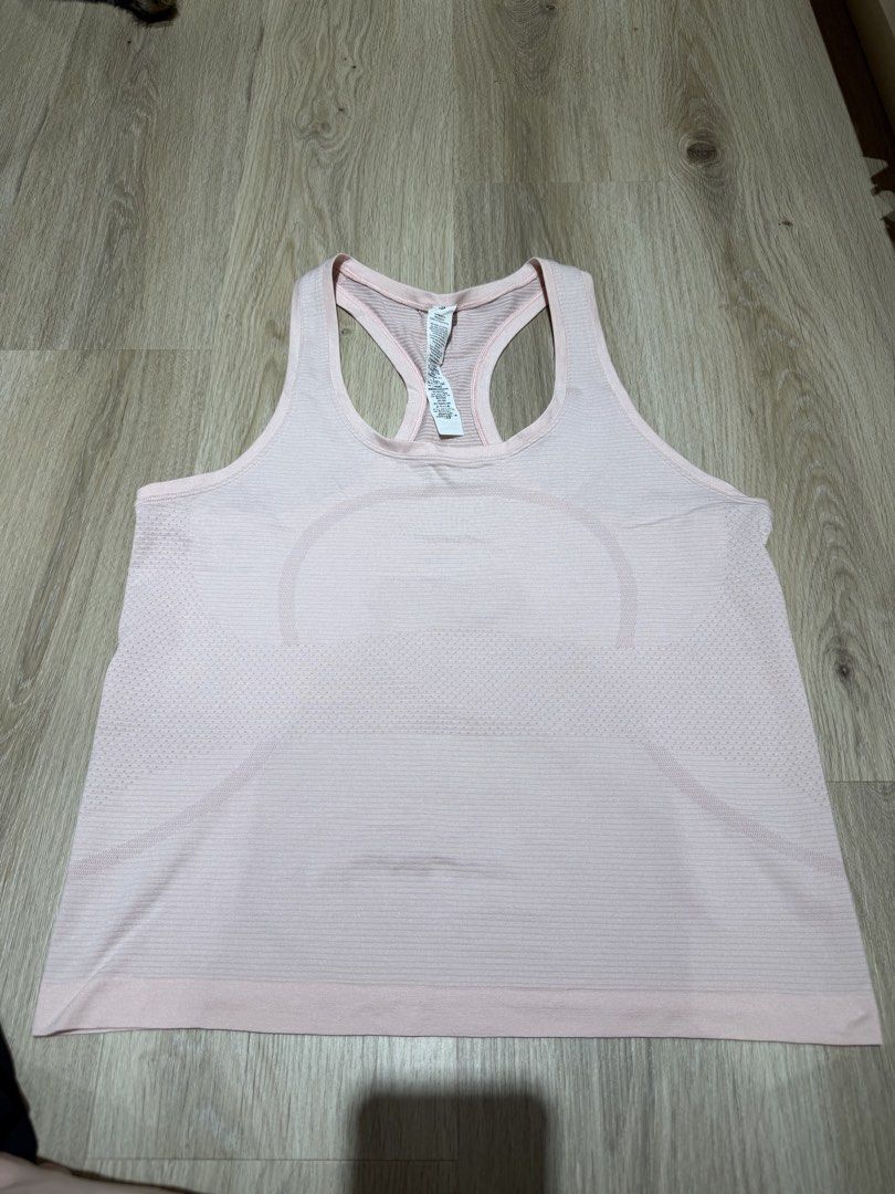 Lululemon Pink Racerback Tank Top Size 8 (Category: Activewear) located in San Juan City. Submitted by lamawears (Listing ID 1446698802, Image 1). Description: Authentic Lululemon Tank Top - baby pink - size 8 - used once, as good as new.