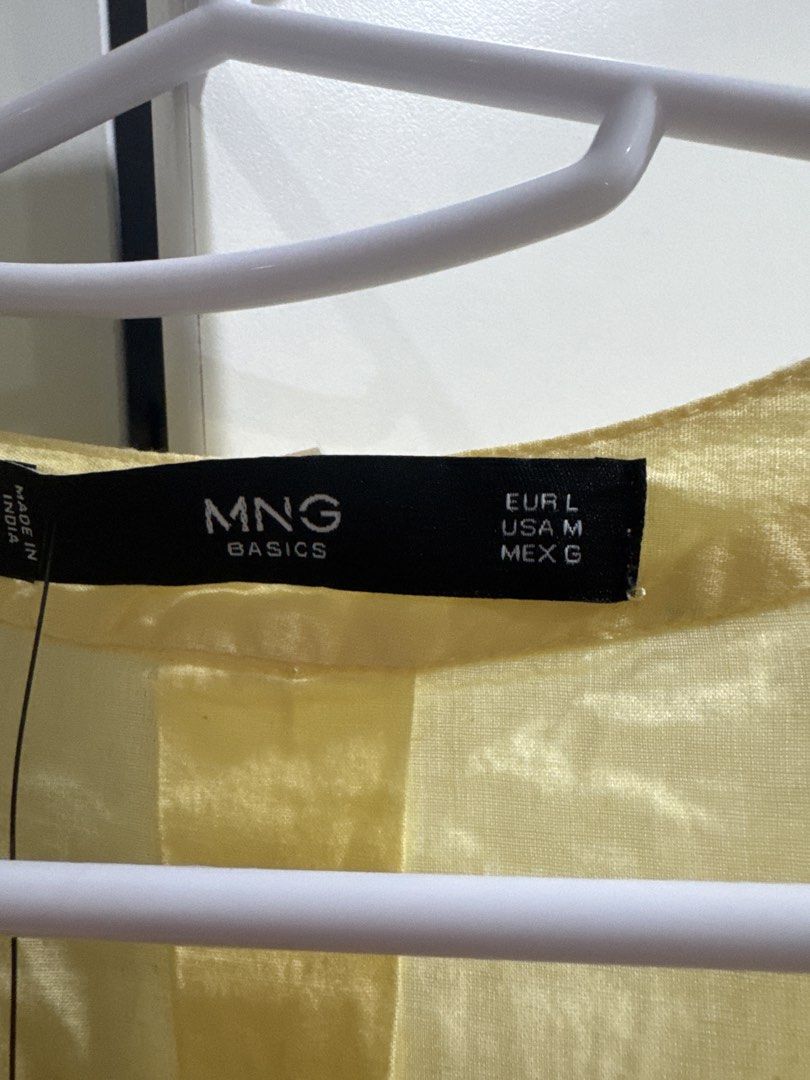 Mango Basics Yellow Long Sleeve Shirt Size L (Category: Shirts) located in Binan City. Submitted by mituz (Listing ID 1446545998, Image 2). Description: - Mango Basics yellow long sleeve shirt - Size: L - Collarless neckline with button-up front - Two chest pockets - Made in India.