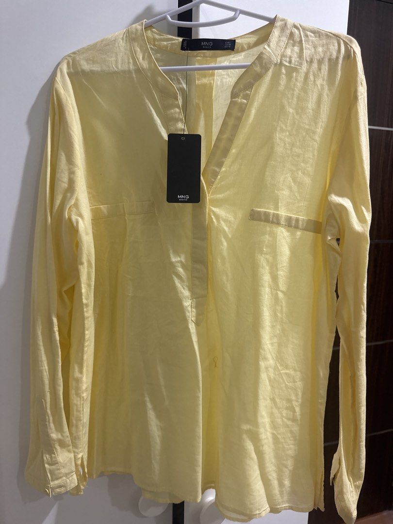 Mango Basics Yellow Long Sleeve Shirt Size L (Category: Shirts) located in Binan City. Submitted by mituz (Listing ID 1446545998, Image 1). Description: - Mango Basics yellow long sleeve shirt - Size: L - Collarless neckline with button-up front - Two chest pockets - Made in India.