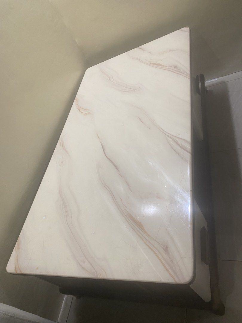Marble Top Coffee Table with Drawers and Storage (Category: Tables & Sets) located in Mandaluyong City. Submitted by minimalist_mak (Listing ID 1446699466, Image 2). Description: - White marble top coffee table - Dark wood base and legs - Two drawers with wooden handles - Open storage space in the middle - Ideal for living room storage and display.