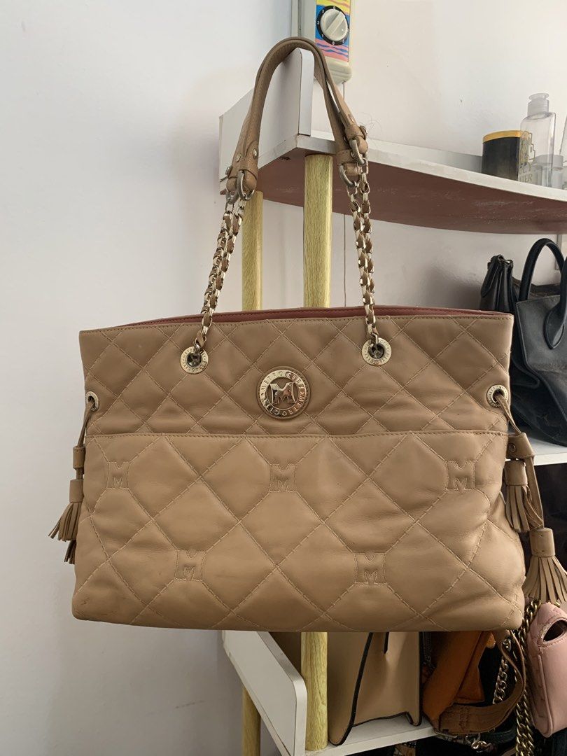 METROCITY Quilted Leather Chain Tote Bag (Category: Tote Bags) located in Cavite. Submitted by Shin.Shoppe (Listing ID 1446569796, Image 2). Description: - METROCITY tan quilted leather tote bag - Elegant gold chain straps - Chic side tassel details - Interior zip pocket and main compartment - Clean interior - Ideal for everyday style.