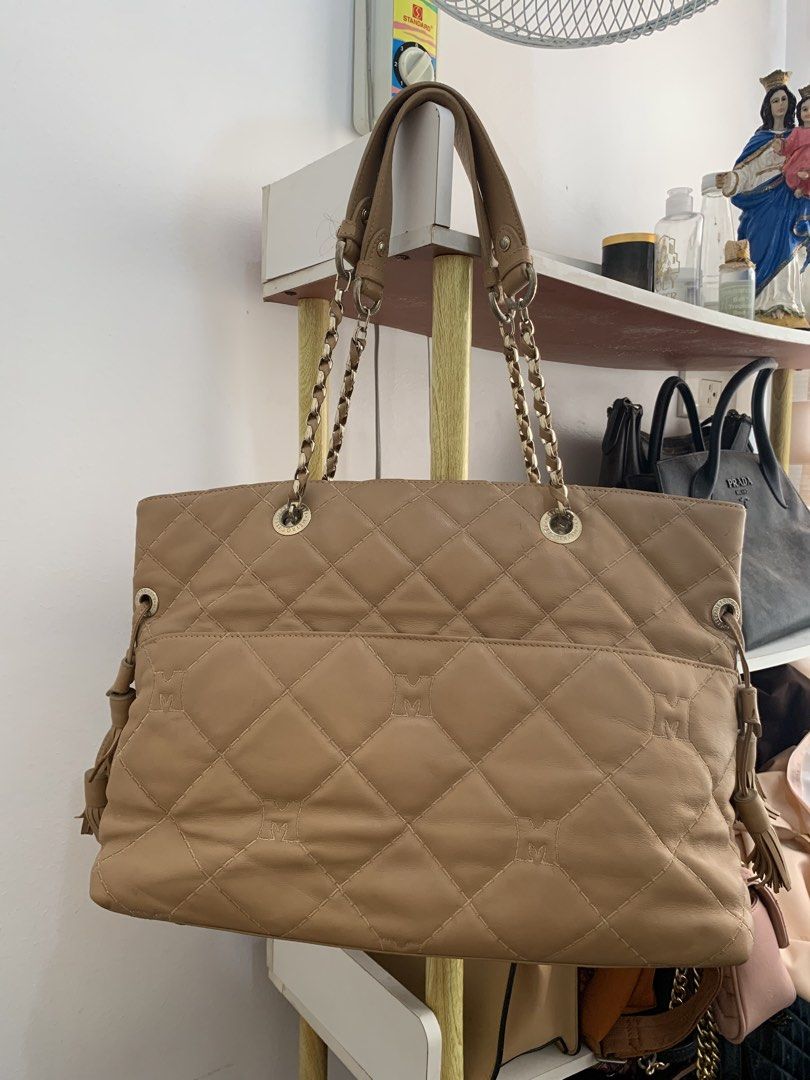 METROCITY Quilted Leather Chain Tote Bag (Category: Tote Bags) located in Cavite. Submitted by Shin.Shoppe (Listing ID 1446569796, Image 3). Description: - METROCITY tan quilted leather tote bag - Elegant gold chain straps - Chic side tassel details - Interior zip pocket and main compartment - Clean interior - Ideal for everyday style.