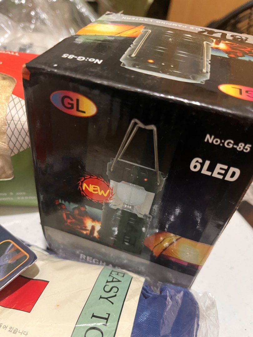 Mini Hammock, LED Lights, Camping Lantern, Carry Bag (Category: Hiking & Camping) located in Manila. Submitted by avery192224 (Listing ID 1446639358, Image 3). Description: - Mini Hammock for relaxing outdoors - Set of 2 Red LED Lights (Lifetime LED) - Rechargeable 6 LED Camping Lantern with 220V charger - USB Output on lantern for charging devices - Comes with a convenient blue carrying bag - Ideal for camping, hiking, and all outdoor adventures