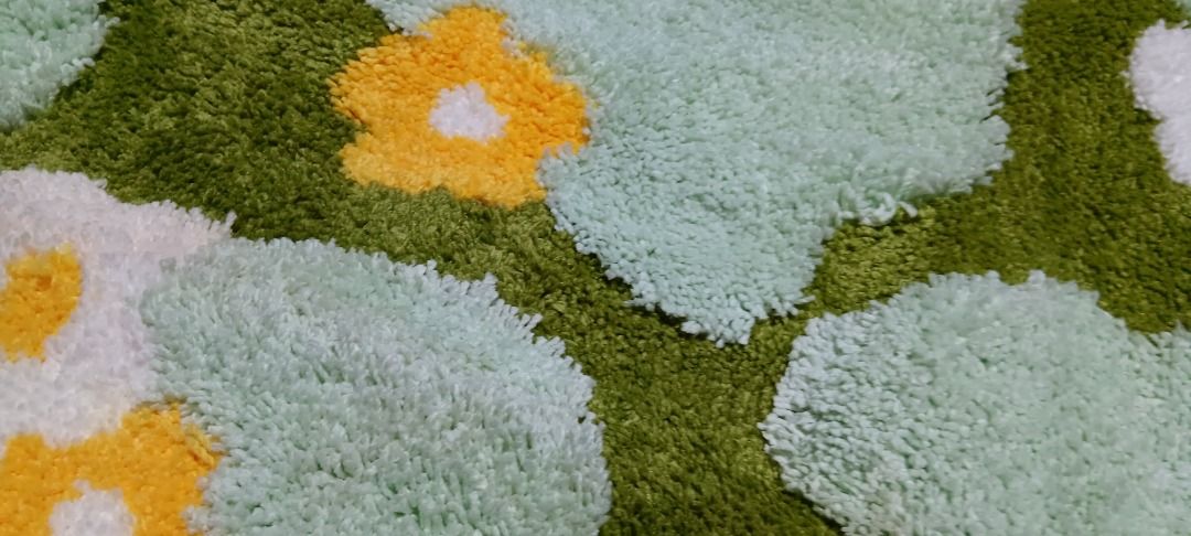 Mossy Grass Fluffy Carpet (Category: Carpets, Mats & Flooring) located in Quezon City. Submitted by piptea (Listing ID 1446632478, Image 2). Description: - round fluffy soft rug, really heavy when rolled up - grass and flower patterns - theres a small tear on the underside but otherwise fine - fibers dont fall out that much - needs cleaning - negotiable RFS: bought this from the orange app but seller gave me the wrong variant, i thought i'd stick