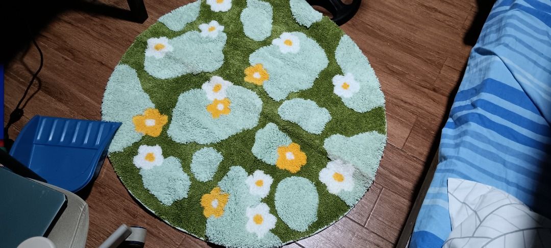 Mossy Grass Fluffy Carpet (Category: Carpets, Mats & Flooring) located in Quezon City. Submitted by piptea (Listing ID 1446632478, Image 1). Description: - round fluffy soft rug, really heavy when rolled up - grass and flower patterns - theres a small tear on the underside but otherwise fine - fibers dont fall out that much - needs cleaning - negotiable RFS: bought this from the orange app but seller gave me the wrong variant, i thought i'd stick