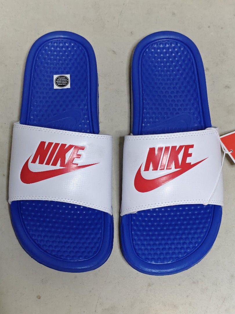 Nike Benassi JDI Slides White Blue Red Size 9 (Category: Slippers & Slides) located in San Juan City. Submitted by zashichua (Listing ID 1446603257, Image 2). Description: - Authentic Nike Brand - Size: 9 - Colorway: White strap with red Nike logo, blue sole and footbed - No original box. will give other box instead .