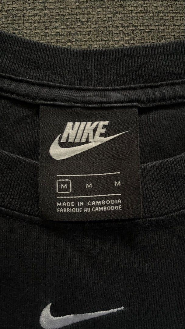 Nike Black T-Shirt Size M (Category: Tshirts & Polo Shirts ) located in Taguig. Submitted by riyowgie (Listing ID 1446568210, Image 2). Description: - Classic black Nike t-shirt - Iconic Nike swoosh logo on chest - Made in Cambodia - Size M - Versatile for everyday wear or workouts.