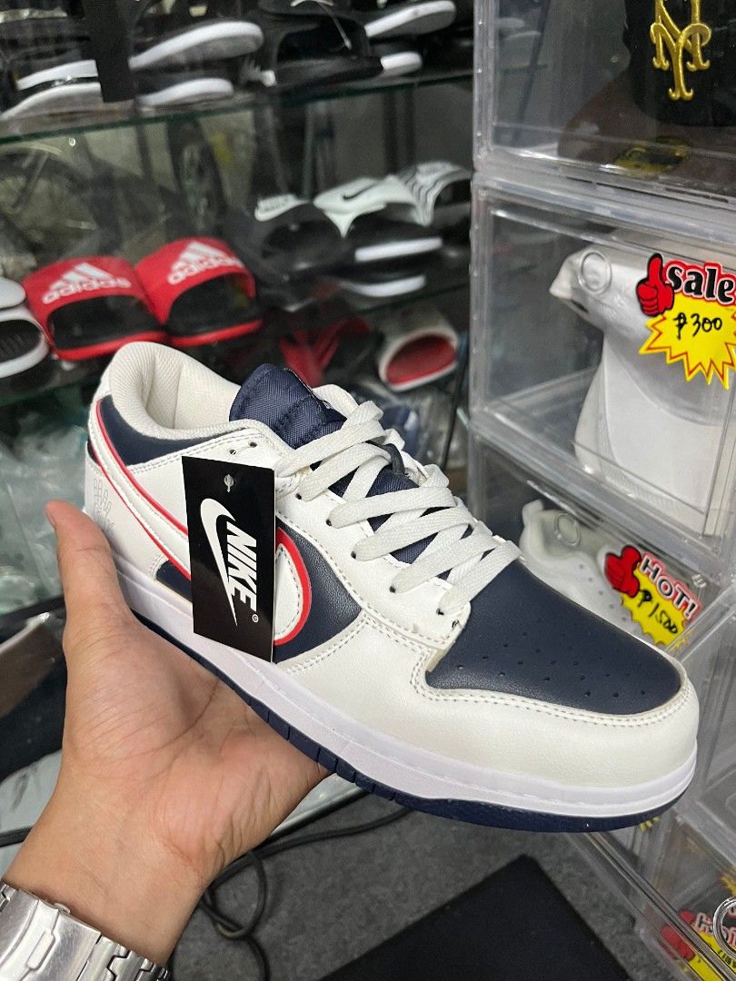 Nike Dunk Low White Navy Red (Category: Sneakers) located in Manila. Submitted by navi1000 (Listing ID 1446650234, Image 1). Description: - DM me for your size - COD - White Nike Dunks - Navy blue accents - Red detailing - Classic low-top silhouette - Includes original Nike tag - Ideal for casual wear or sports.