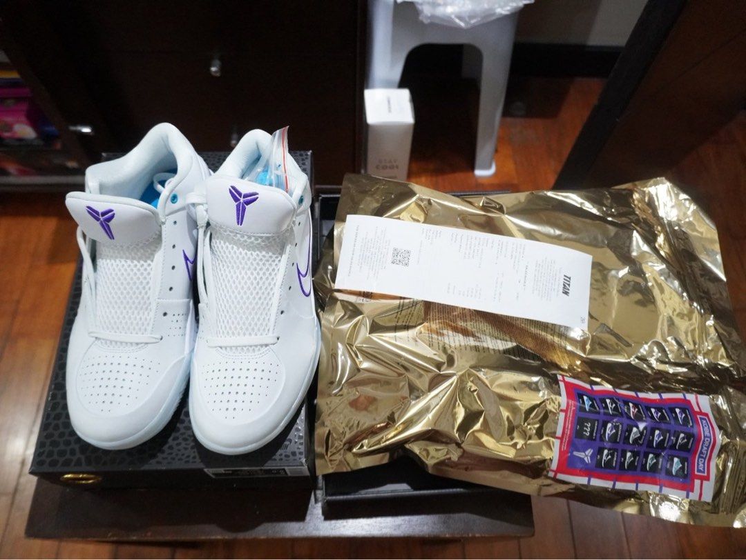 Nike Kobe 4 Protro White Court Draft Pack Hornets (Category: Sneakers) located in Taguig. Submitted by sc2303 (Listing ID 1446613448, Image 2). Description: - Nike Kobe 4 Protro sneakers - Color: White and Purple - Size: 8 US Men's - Includes original box - Includes original receipt from Titan - Ideal for basketball and casual wear.