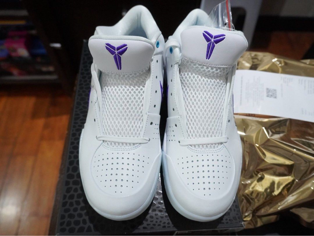 Nike Kobe 4 Protro White Court Draft Pack Hornets (Category: Sneakers) located in Taguig. Submitted by sc2303 (Listing ID 1446613448, Image 1). Description: - Nike Kobe 4 Protro sneakers - Color: White and Purple - Size: 8 US Men's - Includes original box - Includes original receipt from Titan - Ideal for basketball and casual wear.