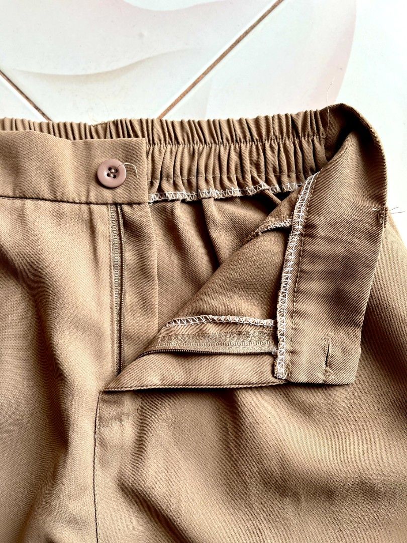 Nude Trouser Pants (Category: Other Bottoms) located in Lingayen. Submitted by kat_declutter (Listing ID 1446553343, Image 3). Description: - Fits 26-30" / 36 inches length -Nude pants with stylish pleats - Flattering high-waisted fit - Comfortable elasticated back waistband - Secure button and zip closure - Convenient side pockets - Classic straight leg cut - Versatile for both casual outings and office wear.