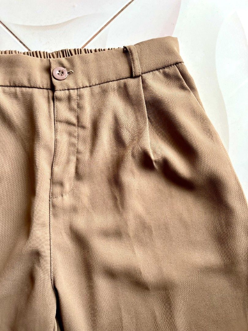 Nude Trouser Pants (Category: Other Bottoms) located in Lingayen. Submitted by kat_declutter (Listing ID 1446553343, Image 2). Description: - Fits 26-30" / 36 inches length -Nude pants with stylish pleats - Flattering high-waisted fit - Comfortable elasticated back waistband - Secure button and zip closure - Convenient side pockets - Classic straight leg cut - Versatile for both casual outings and office wear.