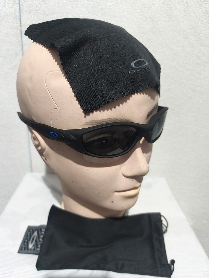 Oakley Sunglasses with Microfiber Pouch and Cleaning Cloth (Category: Sunglasses & Eyewear) located in Pasay City. Submitted by tananoy0508061 (Listing ID 1446705455, Image 2). Description: - Oakley sunglasses - Sleek black frame - Dark, protective lenses - Includes original Oakley microfiber pouch - Comes with original cleaning cloth - Ideal for sports activities - Suitable for everyday wear.