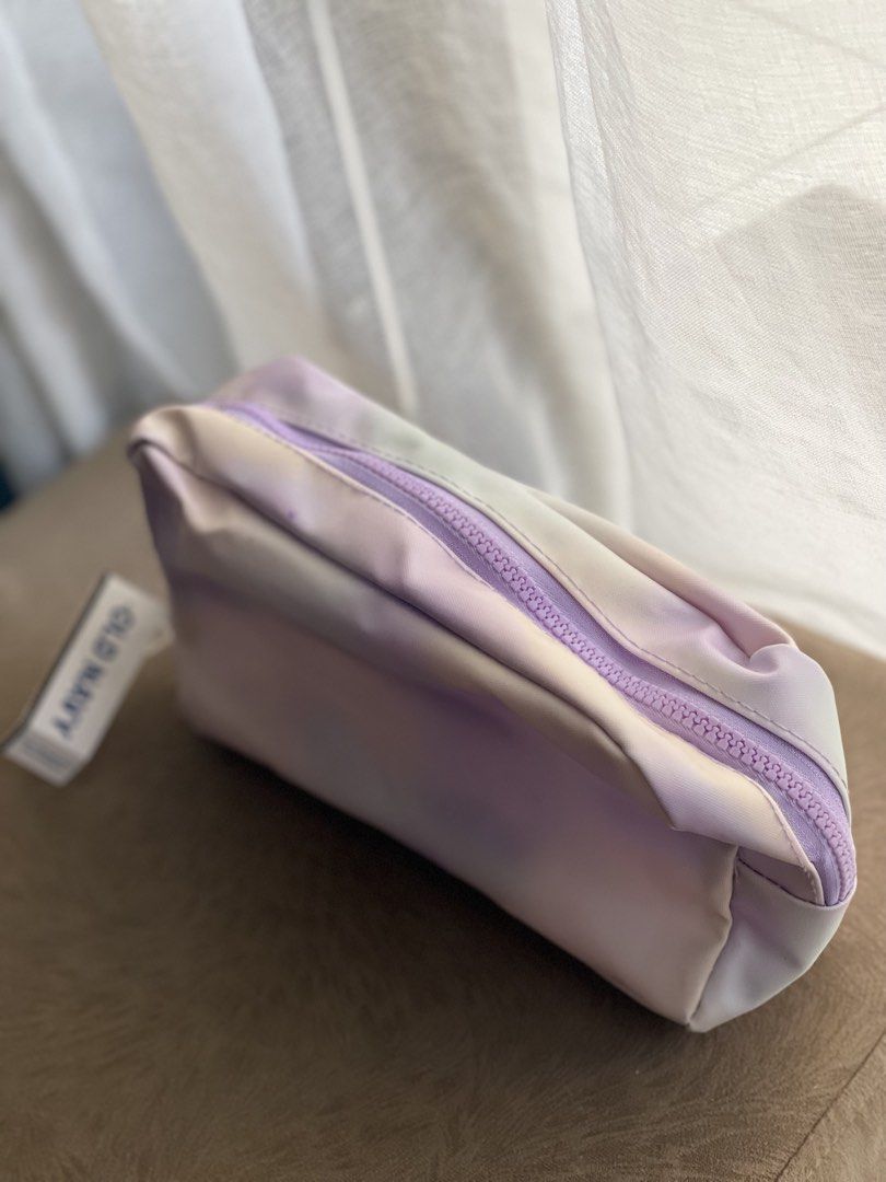 Old Navy Tie-Dye Cosmetic Bag (Category: Purses & Pouches) located in Makati City. Submitted by esila.essentials (Listing ID 1446628434, Image 2). Description: - Cute tie-dye cosmetic bag from Old Navy - Pastel colors: purple, pink, and green - Zipper closure - Easy to clean material - Ideal for makeup or travel essentials - Perfect size for purse or weekender bag.