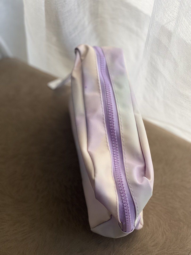 Old Navy Tie-Dye Cosmetic Bag (Category: Purses & Pouches) located in Makati City. Submitted by esila.essentials (Listing ID 1446628434, Image 1). Description: - Cute tie-dye cosmetic bag from Old Navy - Pastel colors: purple, pink, and green - Zipper closure - Easy to clean material - Ideal for makeup or travel essentials - Perfect size for purse or weekender bag.