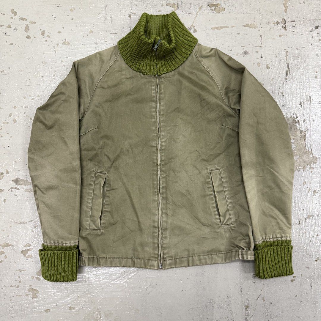 Olive Green Zip-Up Jacket with Green Ribbed Collar and Cuffs (Category: Coats, Jackets and Outerwear) located in Kuala Lumpur. Submitted by prelovedgbk (Listing ID 1446704242, Image 1). Description: - Olive green jacket - High ribbed collar and matching ribbed cuffs in vibrant green - Zip-up front closure - Two side pockets - Ideal for layering - Measurements: Approx. 15" chest, 22" length.