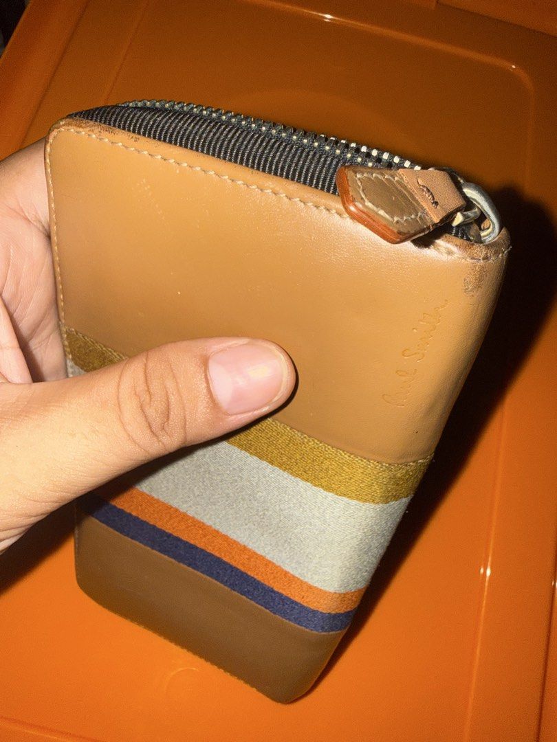Paul Smith Long Zippy Wallet Made In Spain (Category: Wallets & Card holders) located in Cavite. Submitted by okaypreloved (Listing ID 1446621144, Image 2). Description: •HEAVILY USED PRESSED MARKS SCRATCHES •RUBS DIRTS DIRTS DIRTS •ZIP PULLER REPAIRED ALREADY •COLOR WASHED-OUT ALREADY ESPECIALLY CORNERS AND EDGES ALL SALES ARE FINAL AND NONRETURNABLE .