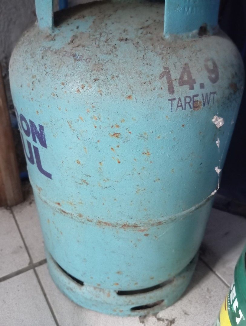 Petron Gasul LPG Cylinder Empty Tank (Category: Other Kitchen Appliances) located in Dasmarinas. Submitted by kei05 (Listing ID 1446596722, Image 2). Description: - Petron Gasul LPG Cylinder - Color: Light Blue - Tare Weight: 14.9 kg - Condition: Shows some rust and scuff marks - Branding: Still has Petron Gasul logo - Ready for refill.