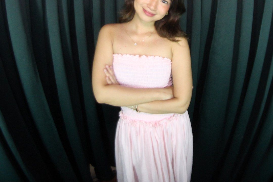Pink Smocked Strapless Maxi Dress (Category: Dresses) located in Pasig City. Submitted by ag_cleanup (Listing ID 1446575013, Image 3). Description: - Light pink maxi dress - Strapless design - Smocked bodice - Flowy skirt - Comfortable and breezy fabric - Ideal for casual outings or beach days - Pairs well with sandals or heels.