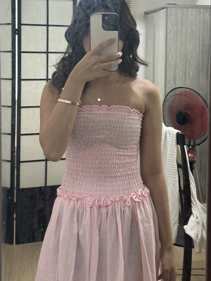 Pink Smocked Strapless Maxi Dress (Category: Dresses) located in Pasig City. Submitted by ag_cleanup (Listing ID 1446575013, Image 2). Description: - Light pink maxi dress - Strapless design - Smocked bodice - Flowy skirt - Comfortable and breezy fabric - Ideal for casual outings or beach days - Pairs well with sandals or heels.
