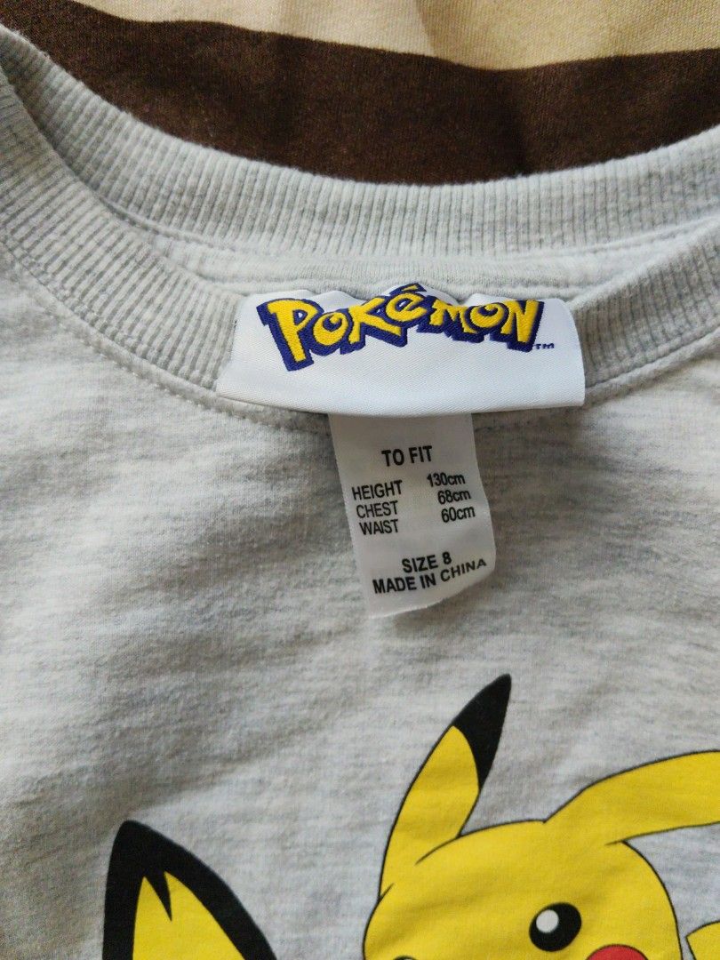 Pokemon Pikachu Sweatshirt Grey Blue Red Sleeves Size S (Category: Babies & Kids Fashion) located in Batangas. Submitted by ms.d_preloveditems (Listing ID 1446549521, Image 3). Description: - Official Pokemon merchandise - Grey sweatshirt with iconic Pikachu graphic - Contrasting red and blue sleeves - Size S (fits height 130cm, chest 66cm, waist 60cm) - Perfect for any Pokemon fan! - Easy care: Machine washable (do not tumble dry) - Made in Chin