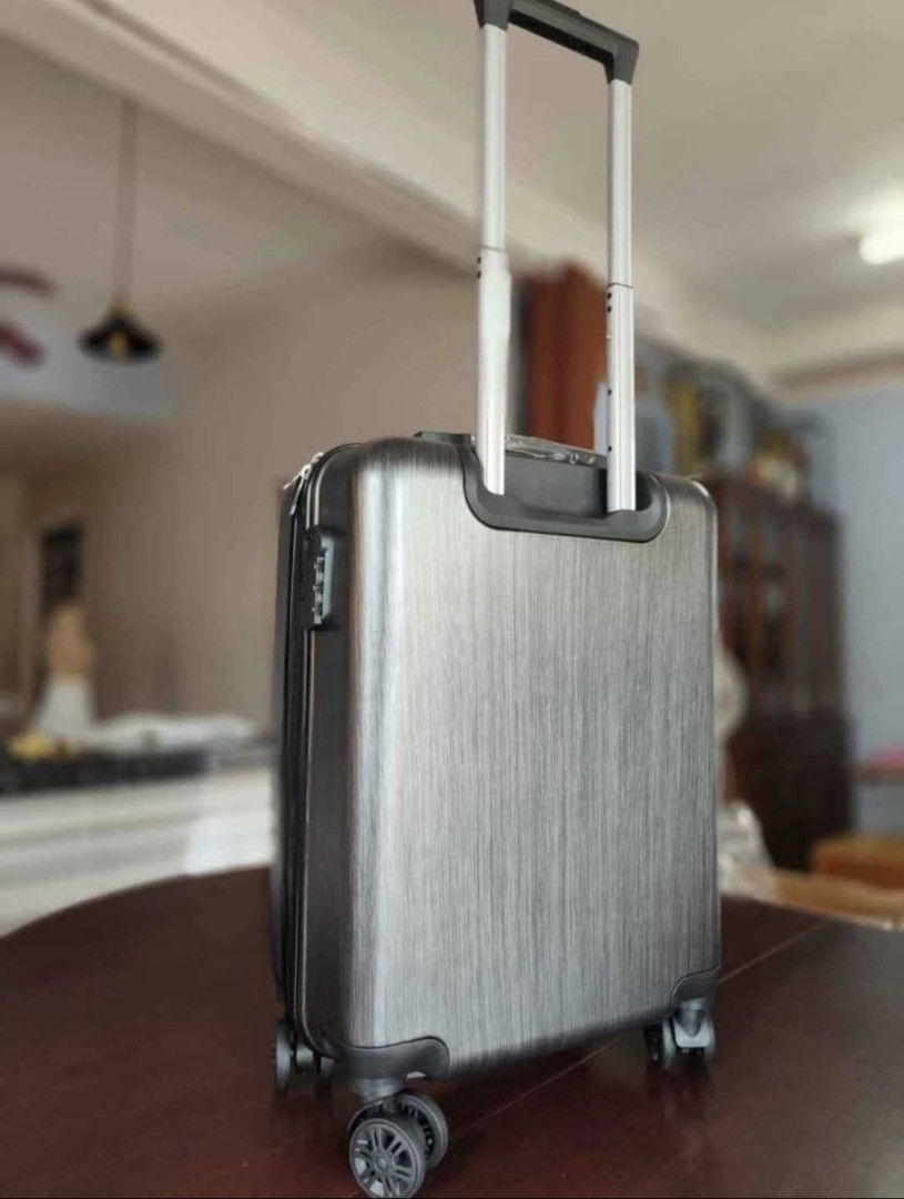 Porsche Design HandCarry Luggage Suitcase (Category: Luggage) located in Quezon City. Submitted by gadgetsun (Listing ID 1446541617, Image 2). Description: - Stylish grey luggage - Secure lock for peace of mind - Effortless maneuverability with spinner wheels - Organized interior with straps and zippered compartment - Ideal for all your travel needs.