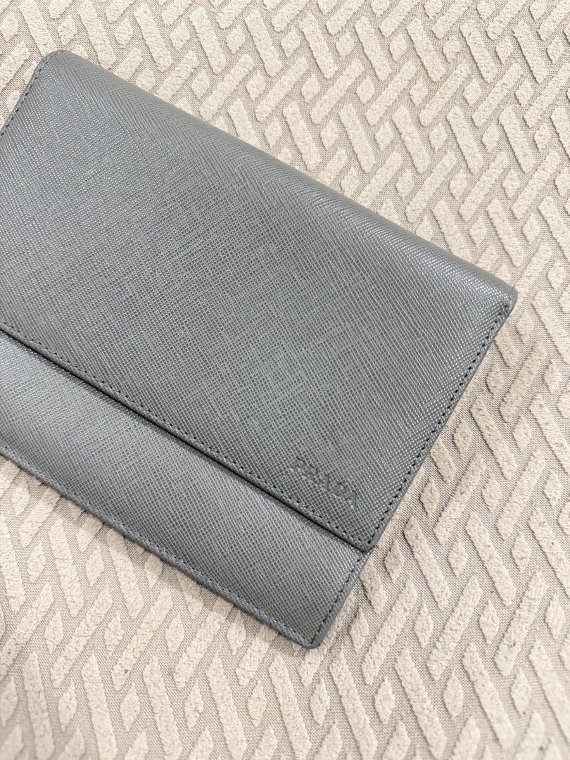 Prada Saffiano Leather Wallet Grey (Category: Luxury Bags & Wallets) located in Cebu City. Submitted by myclosettoyours_cebu (Listing ID 1446690564, Image 1). Description: - Authentic Prada Wallet - Made in Italy - Saffiano Leather - Color: Grey - Snap Closure - Multiple Card Slots With normal signs of use hence selling very slow .