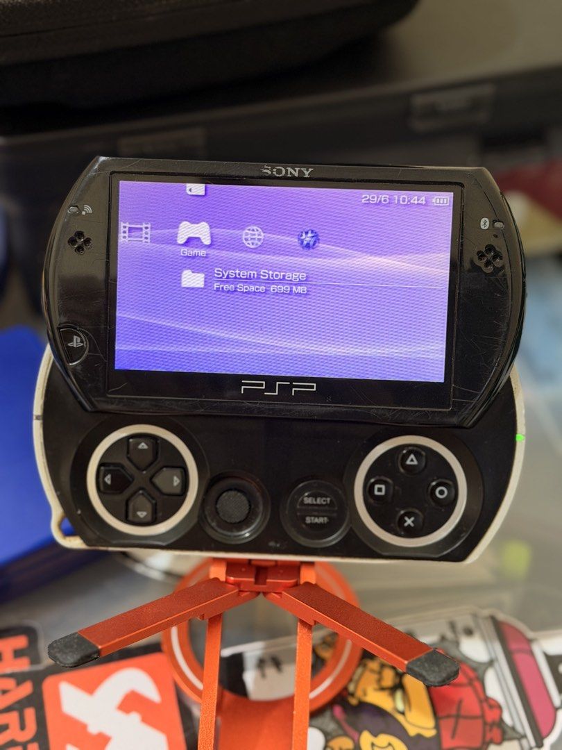 PSP GO (Category: PlayStation) located in Tarlac. Submitted by arteesan (Listing ID 1446561252, Image 3). Description: PSP GO 16GB internal CFW ready Charging cable M2 adapter with original 32GB sd card Makunat battery Issue: signs of usage. Scratch sa shell pero di naman halata pag gaming. .