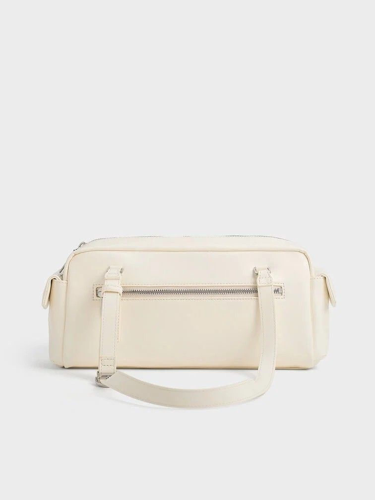 Rachel Multi-Pocket Shoulder Bag (Category: Luxury Bags & Wallets) located in Makati City. Submitted by zoeppe_online (Listing ID 1446718888, Image 3). Description: Rachel Multi-Pocket Shoulder Bag This Charles & Keith Rachel Multi-Pocket Shoulder Bag is featured in a glossy black finish with adjustable top handles and functional front pockets. ORG: ₱4,599.00 SALE: 2,500.00.