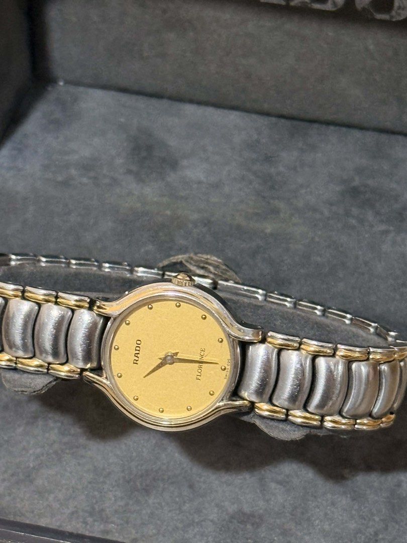 Rado Florence Two-Tone Quartz Watch (Category: Luxury Watches) located in Manila. Submitted by justhazel (Listing ID 1446582579, Image 3). Description: - Rado Florence Watch - Two-tone stainless steel and gold-plated bracelet - Classic gold dial - Includes original Rado box - Battery recently replaced - A timeless addition to your collection.