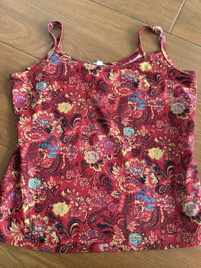 Red Floral Print Spaghetti Strap Tank Top (Category: Babies & Kids Fashion) located in Bulacan. Submitted by emjay_17 (Listing ID 1446632712, Image 2). Description: - Eye-catching red tank top - Features a vibrant floral and paisley print - Thin spaghetti straps - Made with stretchy material for a comfortable fit - Versatile: great for layering or wearing on its own - Easy to pair with jeans or shorts.
