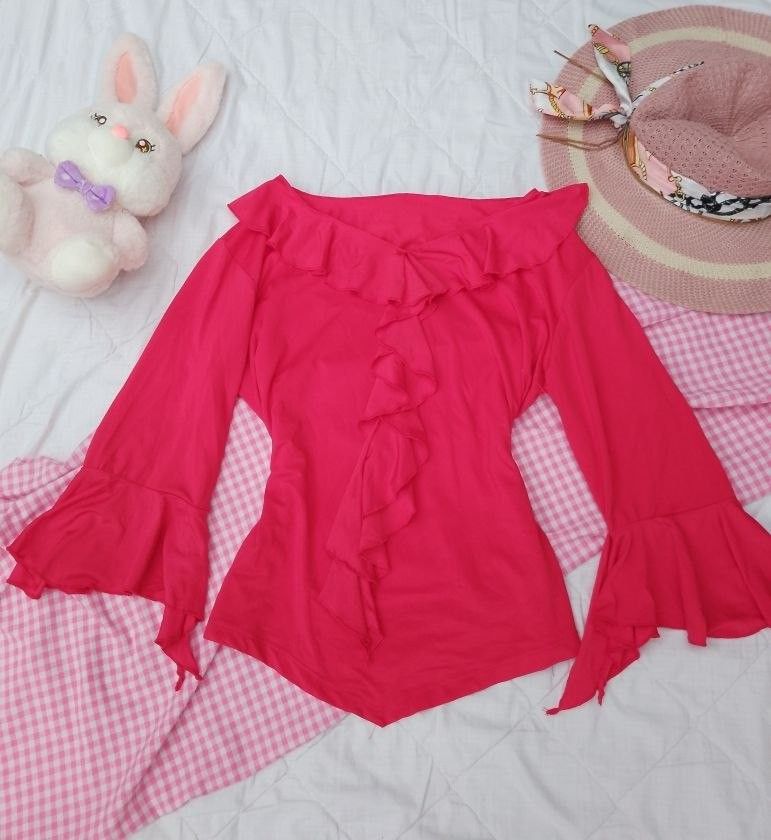 Red Ruffle Off-Shoulder Bell Sleeve Top (Category: Blouses) located in Laur. Submitted by zystilo (Listing ID 1446684522, Image 1). Description: - small - large - Features charming ruffles down the front - Stylish bell sleeves for a playful look - Versatile: great for nights out or casual days - Comfortable and easy to wear - Pairs perfectly with jeans or skirts.