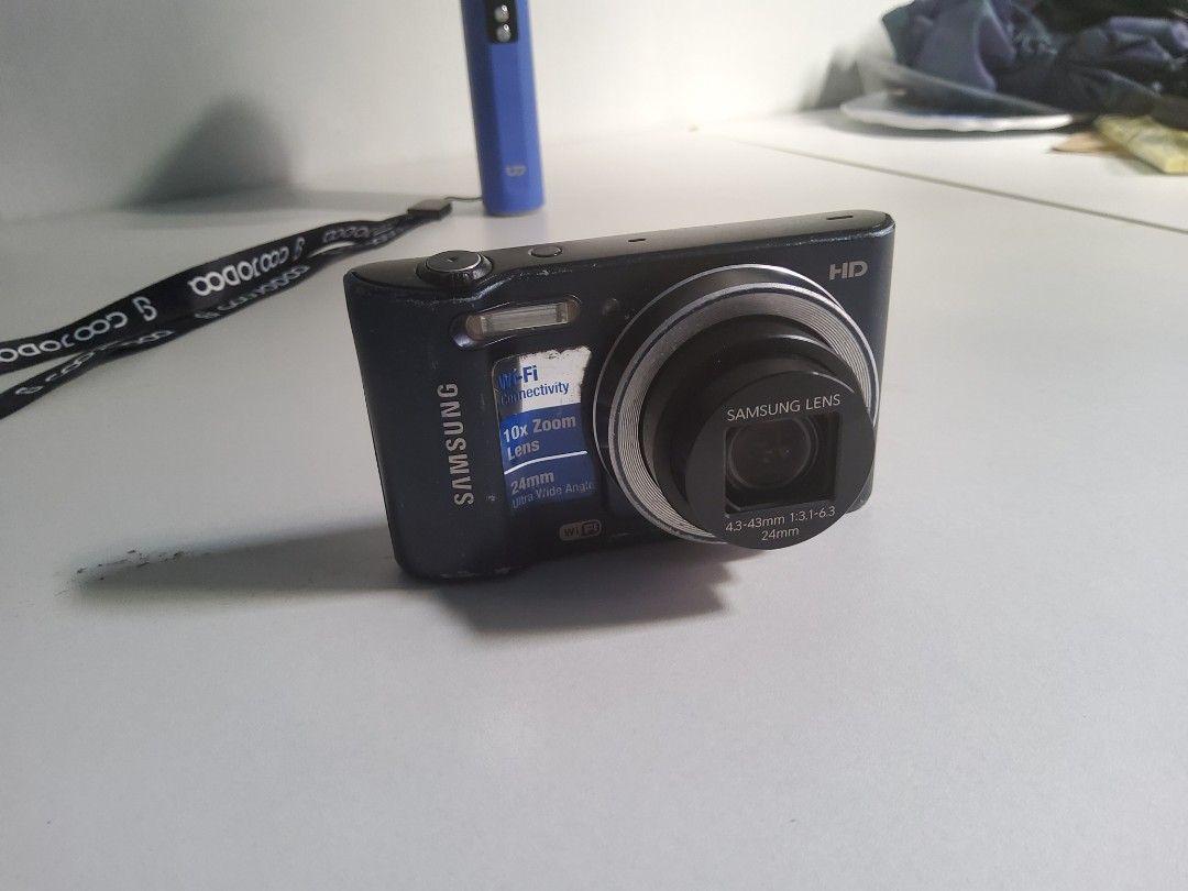 Samsung HD Digital Camera 10x Optical Zoom (Category: Cameras) located in Tuguegarao City. Submitted by yeonlim (Listing ID 1446610332, Image 1). Description: NEGOTIABLE - Samsung HD Digital Camera - 10x Optical Zoom - 24mm Ultra Wide Angle Lens - Built-in Wi-Fi Connectivity - Includes Camera Strap - Ideal for Everyday Photos & Travel • Minor issue is that the battery seems to be old and has to be replaced because sometimes it needs to be charged
